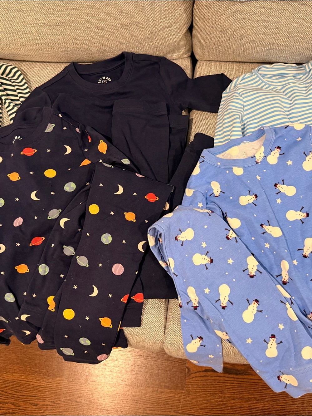 Primary Kids Pajama Sets in Navy & Light Blue with Space and Snowman Prints